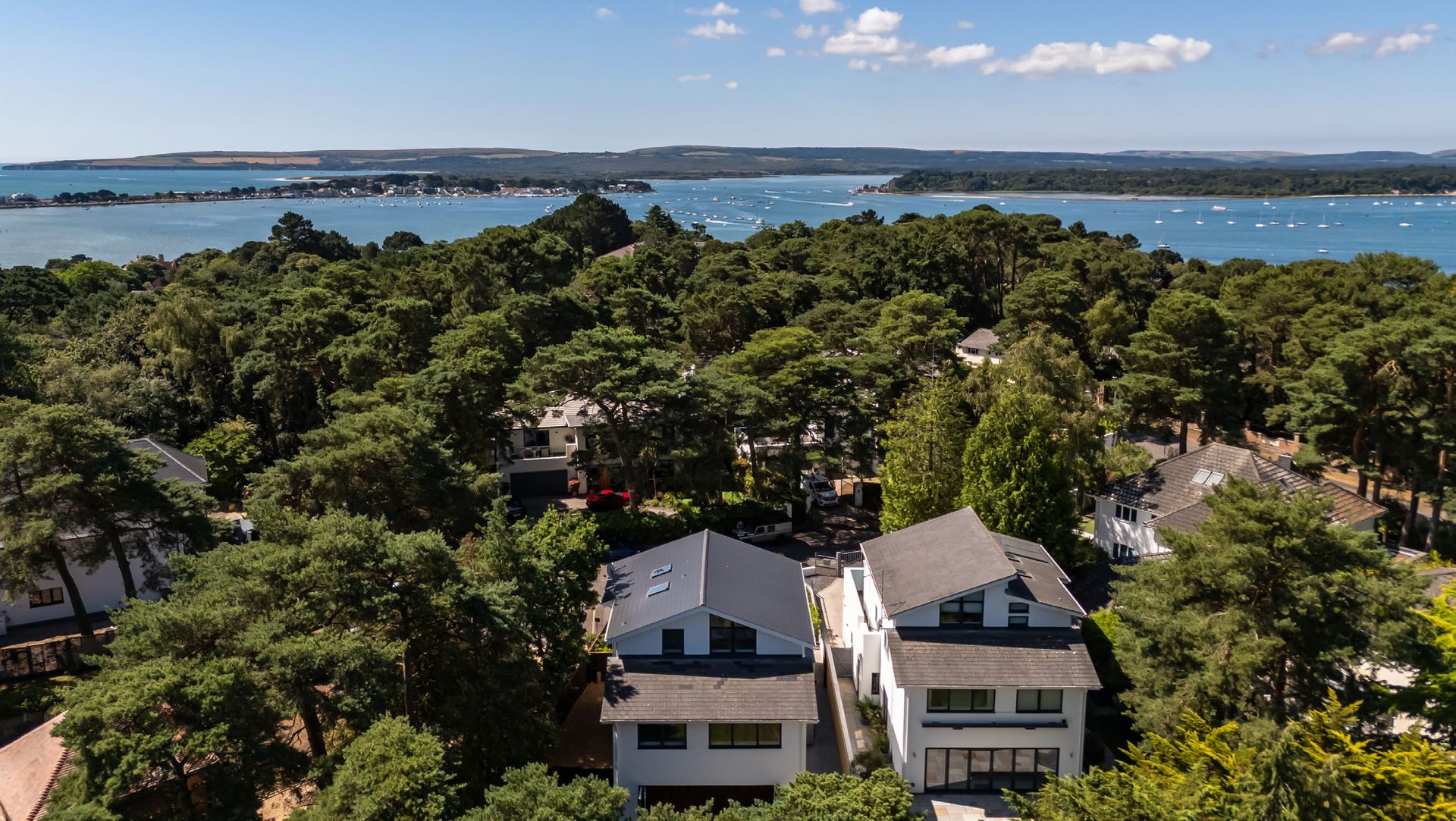 Aerial view over Evening Hill and Poole Harbour at golden hour