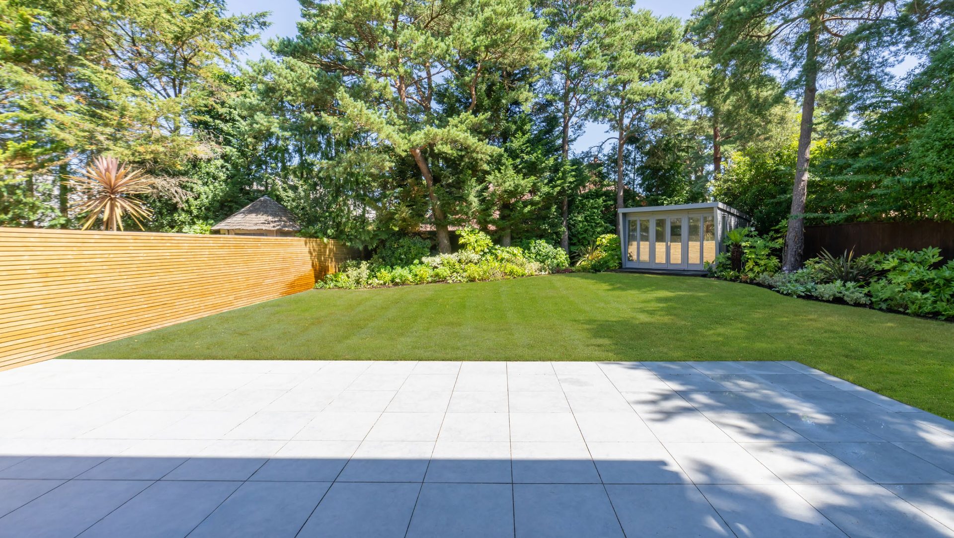 Landscaped rear garden with summer house