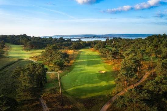 Parkstone Golf Club, heathland fairways with the harbour beyond
